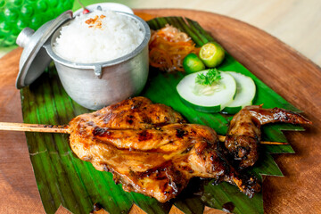 Juicy Chicken Inato with a serving of garlic rice and atchara. A popular grilled dish in Cebu.