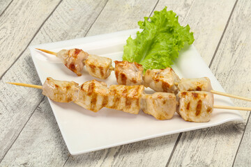 Grilled pork skewer served salad