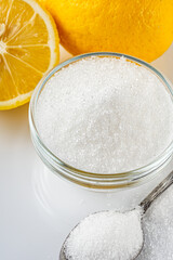 citric acid on a white acrylic background