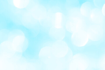 Bokeh light on blue background, sky with circle glitter light blue. Snow abstract soft glowing with vivid bright light and bokeh blur effect. 