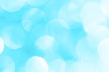 Bokeh light on blue background, sky with circle glitter light blue. Snow abstract soft glowing with vivid bright light and bokeh blur effect. 