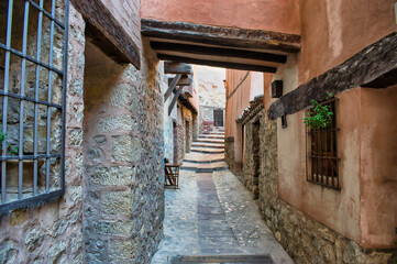 Fototapeta na wymiar Street and passage of medieval architecture in the town of Albarracin, Teruel, Spain