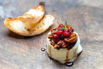Christmas cheese with nuts, figs and cranberry topping
