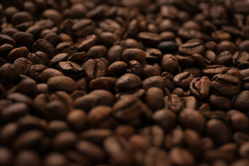 Roasted coffee beans close up blur background