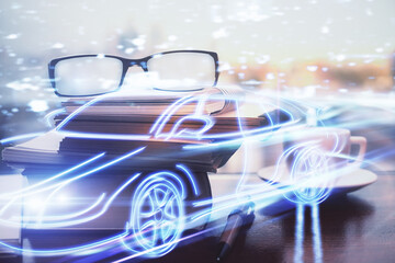 Obraz premium Automobile theme hologram with glasses on the table background. Autopilot concept. Double exposure.
