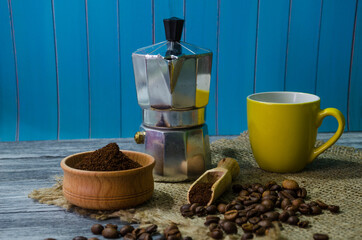 Still life with coffee beans on the wooden background