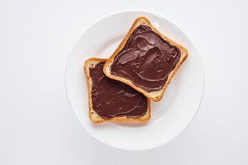 toasts with chocolate butter on a white acrylic background