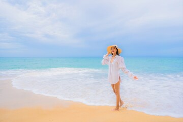 Fototapeta na wymiar Portrait beautiful young asian woman relax leisure smile around beach sea ocean