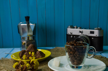 Still life with coffee beans on the wooden background