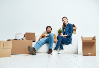 young married couple boxes with things moving room interior fun