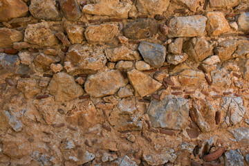 Antique stone wall. Old gray bricks background.