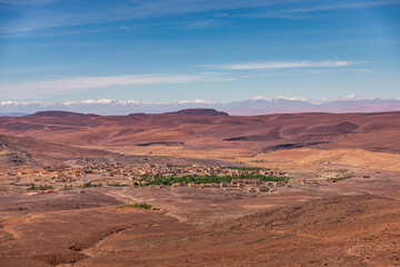 Fototapeta na wymiar Daytime wide angle shoot of a town and the Atlas Mountains in the background, Morocco.