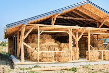 Straw bale house construction with a roof