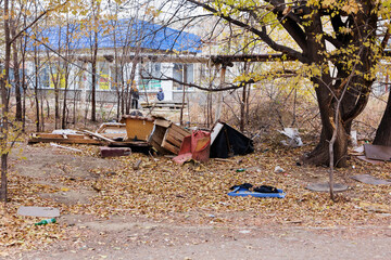 A small illegal dump in a residential area of the city.
