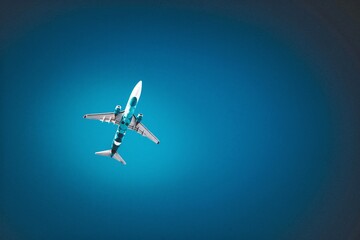 The plane takes off, the image on a blue background.
