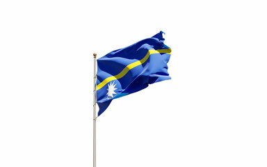 National state flag of Nauru fluttering at sky background.