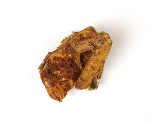 Indonesian spices fried chicken, isolated white background. a portrait of fried chicken thigh and chicken breast.
