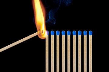 One match ignites a row of matches, maintaining social distance, protecting against coronavirus