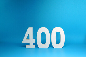 Four Hundred ( 400 ) white wooden  Isolated blue Background with Copy Space - New promotion 400%...