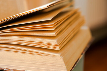 Open book, hardback books on bright colorful background.
