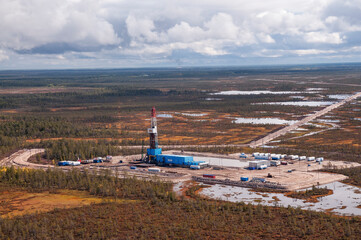  Oil rig in swampy and wooded area. There are clean lakes around. Oil production (top view)