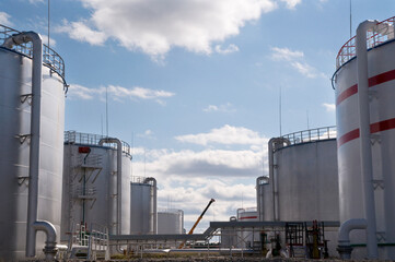 Tanks for storing petroleum products in a large industrial area. View from the oil reservoir.