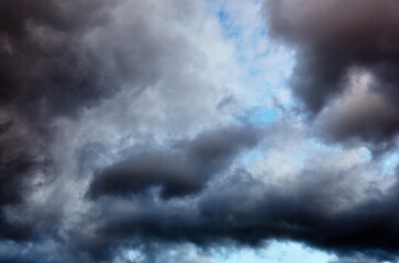Naklejka na ściany i meble Dramatic black cloud before rainy. Beautiful cloudscape over horizon, sky