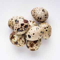 Obraz premium fresh quail eggs on a white acrylic background