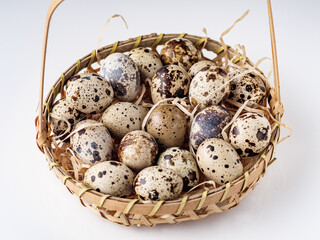 fresh quail eggs on a white acrylic background