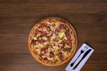 Complete Portuguese Pizza accompanied by a glass of red wine. Gastronomic photography with centralized elements. Top View.