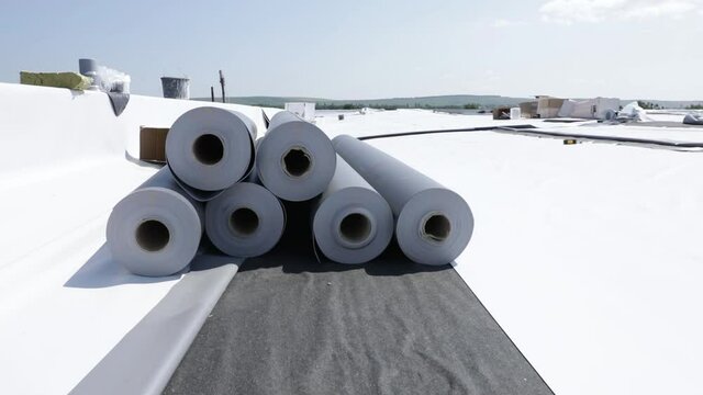 Stack of synthetic pvc membrane rollers on a flat roof