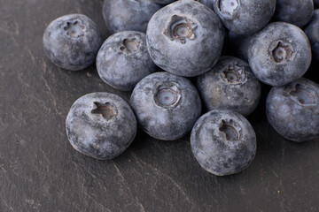 Berry background. Fresh berry blueberries on a white background. Concept of healthy and diet food. Flat lay, top view, Ripe blueberries with copy space for text, shallow DOF