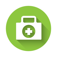 White First aid kit icon isolated with long shadow. Medical box with cross. Medical equipment for emergency. Healthcare concept. Green circle button. Vector Illustration.