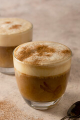 Two glasses of coffee drink with whipped milk, latte hot drink
