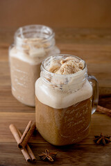 Coffee drink affogato, with ice cream. Wooden table.