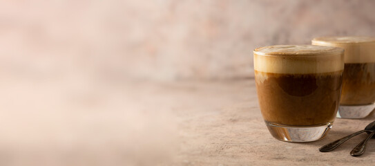 Coffee drink with whipped milk, latte hot drink. Coffee glass banner, copy space. - obrazy, fototapety, plakaty