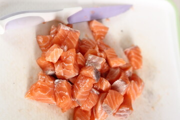 Diced salmon fillet. Making Salmon in Puff Pastry Series.