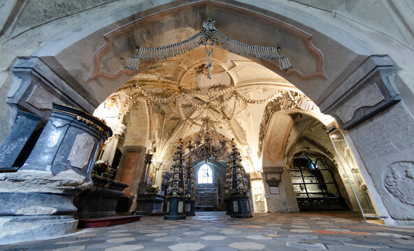 KUTNA HORA, CZECH REPUBLIC - August 14, 2019: Interior of the ossuary in Sedlec Kostnice. Ossuary Contain Skeletons about 50,000 People, Whose Bones Been Arranged To Form Decorations For Chapel.
