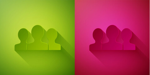 Paper cut Users group icon isolated on green and pink background. Group of people icon. Business avatar symbol - users profile icon. Paper art style. Vector.