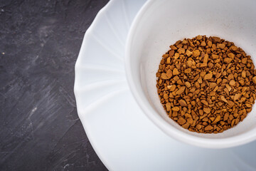 cup of instant coffee on a dark stone background