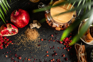 Fruit hot tea with the addition of oranges, lemons, mandarins and raspberries in a glass cups on a table. Healthy hot drink. tea with fruit and berries in a glass teapot. tea for colds.