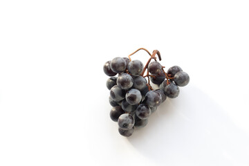 Isabella grapes on a white background top view