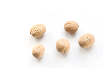 Walnuts on a white background top view
