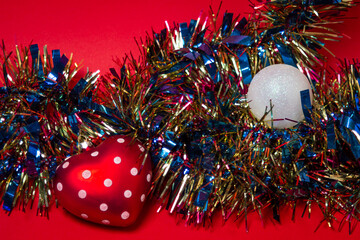 Heart shaped christmas tree toy. Christmas decorations on a red background. Holiday decorations. Christmas concept. 