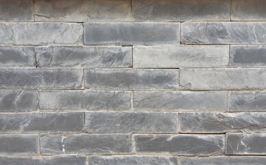 Gray brick wall for background.