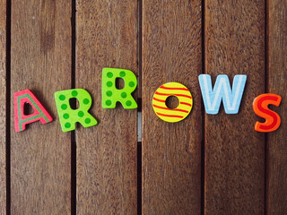 arrows signs on wood background