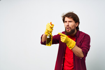 man with detergent in rubber gloves hands service professional
