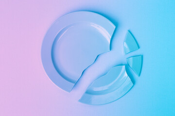 pieces of broken cymbal stacked in one piece, pink and blue gradient. The concept of breaking up...
