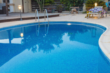 Blue water swimming pool close up view