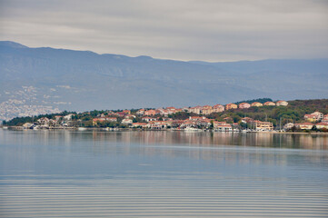 Fototapeta na wymiar Island Krk - Klimno town and beautiful Green Bay, Croatia . Calm Adriatic Sea. Croatian coastline.